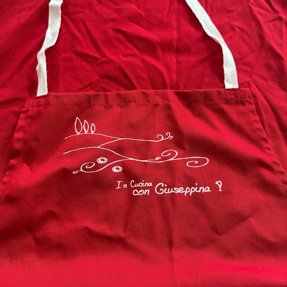 Red Apron with White Design